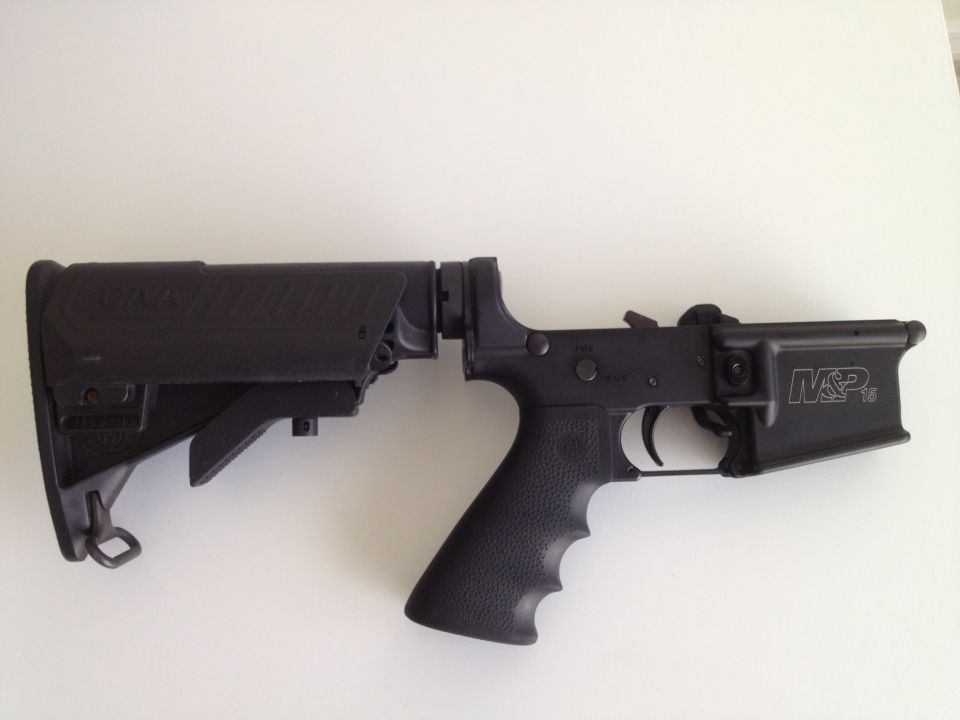 AR-15 lower receiver with M&P markings and a CAA stock