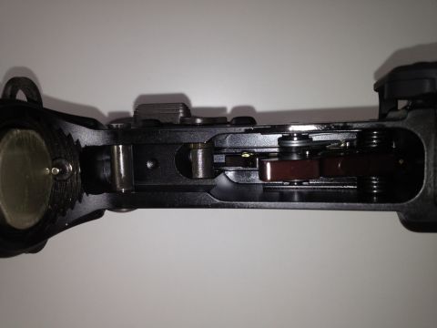 2013 Ford Mustang - Internal view of a firearm's trigger assembly, showing intricate mechanical components.