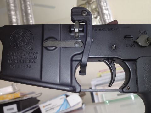 2013 Ford Mustang - The image shows a firearm part, specifically the lower receiver of a Smith & Wesson M&P-15, with visible markings.