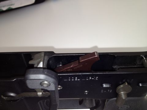 2013 Ford Mustang - Close-up view of a gun receiver showing internal components and markings.
