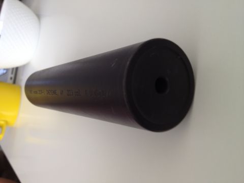 2013 Ford Mustang - A black suppressor is shown with text and caliber markings visible on its side.