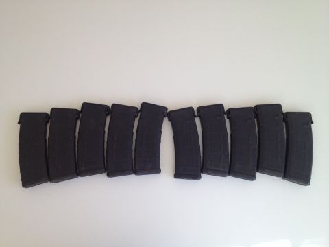 2013 Ford Mustang - A collection of ten black rifle magazines is displayed against a white background.