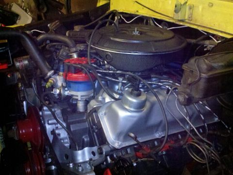1978 Ford Bronco - Close-up view of a V8 engine, likely undergoing a rebuild, with various components visible.