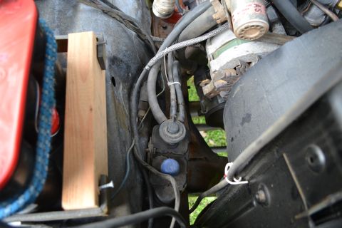 1978 Ford Bronco - Close-up view of engine bay components, including hoses and wiring.