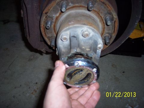 1973 Ford F-250 - A person is removing a chrome locking hub from a vehicle's wheel assembly. The date 01/22/2013 is visible.