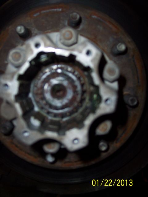 1973 Ford F-250 - A close-up view of a wheel hub assembly, showing rust and wear, with a date stamp of 01/22/2013.