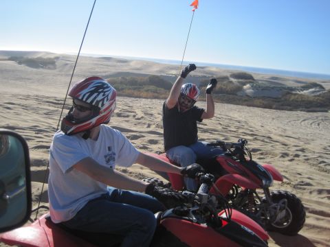 1989 Ford Bronco - Riding ATVs through the sand dunes with the ocean in the background.