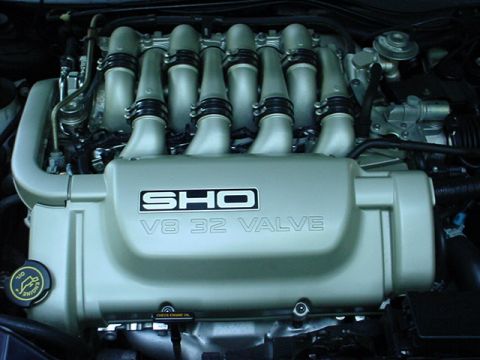 1998 Ford Taurus - Close-up of the 1998 Ford Taurus SHO V8 32 Valve engine, highlighting the distinctive intake manifold and valve cover.
