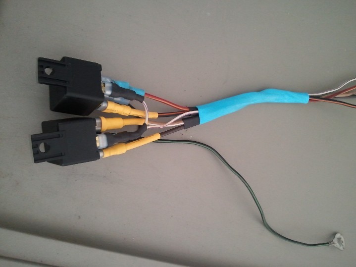 Wiring harness with two black connectors and yellow RCA connectors