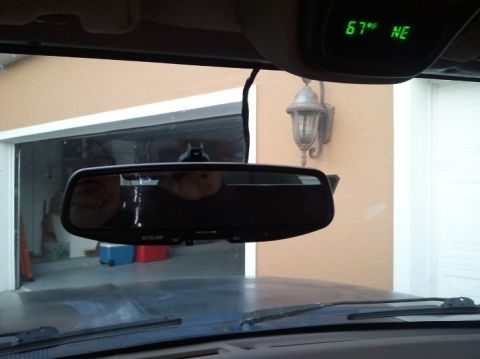 1994 Ford Bronco - The interior view shows a rearview mirror and an overhead console displaying the temperature and direction.