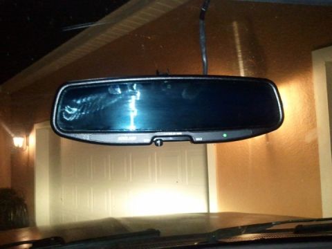 1994 Ford Bronco - The interior rear view mirror appears to be an aftermarket or upgraded unit with auto-dimming and compass functions.