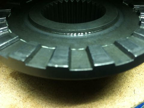 1985 Toyota Pickup/SR5 - A close-up view of a differential gear, showing its internal splines and teeth.
