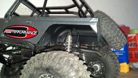 1993 Toyota 4Runner - RC rock crawler with a roll cage and large tires is shown from the rear quarter.