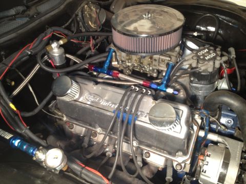 1972 Ford Ranchero - Close-up view of a modified engine bay, highlighting custom fuel system components and chrome accents.