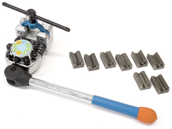Brake line flaring tool kit with ratchet handle and eight steel die blocks on white