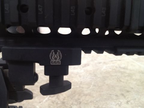 2013 Ford Mustang - A close-up of a black rail system with a GGG logo and mounting hardware is visible.