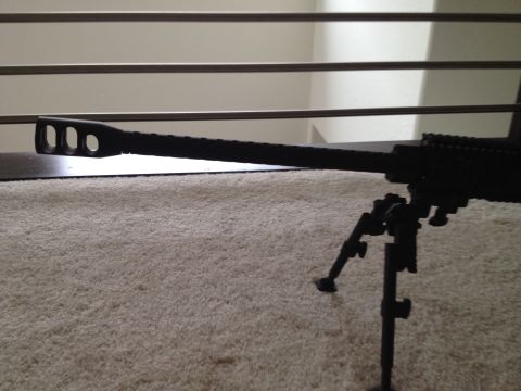 2013 Ford Mustang - A rifle with a bipod is visible on a carpeted surface.