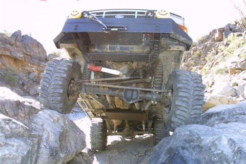 1994 Ford Bronco - This heavily modified 1992 Ford Bronco navigates a rocky trail, its robust off-road capabilities.