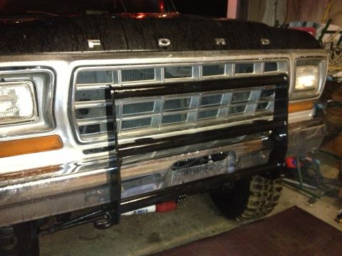 1979 Ford Bronco - Front view of a 1979 Ford Bronco its distinctive grille and a heavy-duty bull bar.