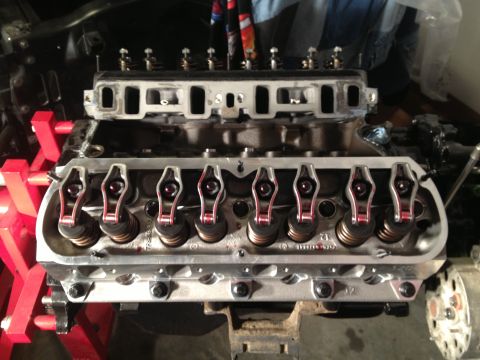 1965 Ford Mustang - Close-up view of an engine's valve train components, including rocker arms and valve springs.