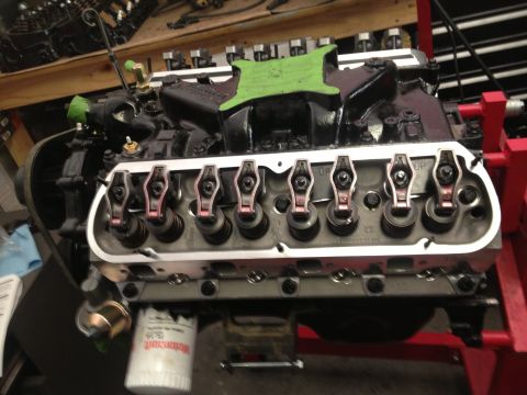 1965 Ford Mustang - Close-up view of an engine's valve train components, with a Motorcraft oil filter attached.