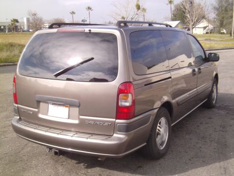 2005 Chevrolet Venture - Rear view of a tan 2005 Chevrolet Venture minivan parked outdoors.