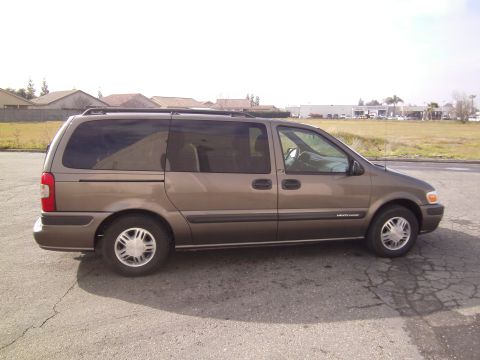 2005 Chevrolet Venture - Side view of a 2005 Chevrolet Venture minivan parked outdoors.