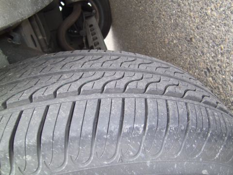 2005 Chevrolet Venture - Tire tread detail with visible suspension parts in the background.