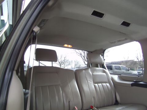 2005 Chevrolet Venture - View of the interior of a minivan, showing the rear seats and ceiling with air vents.