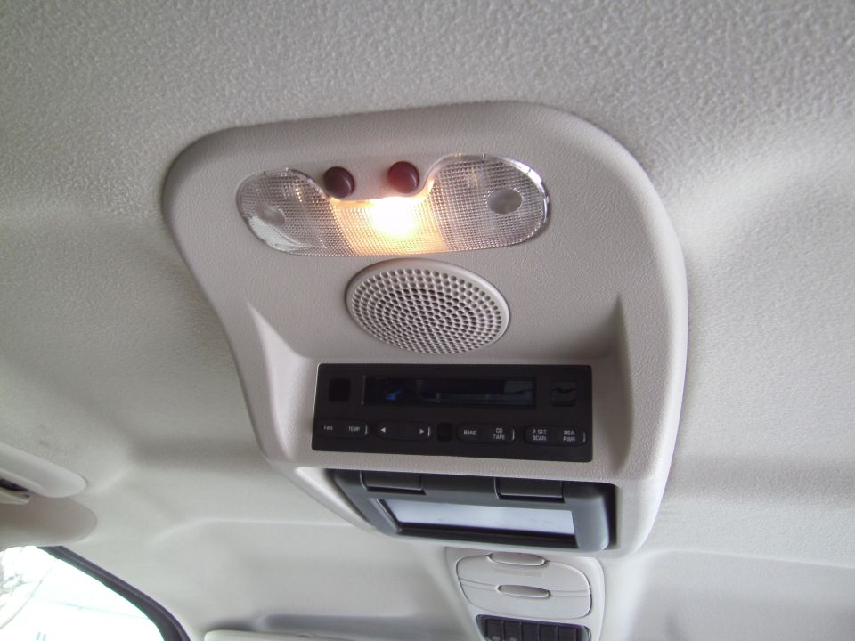 Overhead console with lights, speaker, radio, and CD player