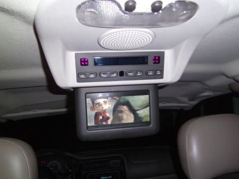 2005 Chevrolet Venture - Interior view of a vehicle's overhead console with an entertainment screen.