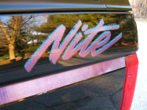 1994 Ford Bronco - The 'Nite' decal is visible on the side of the vehicle, with a pink and blue gradient.
