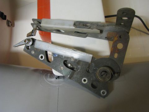 2005 Ford Excursion - Close-up view of a complex door latch mechanism, likely from a vehicle's interior.