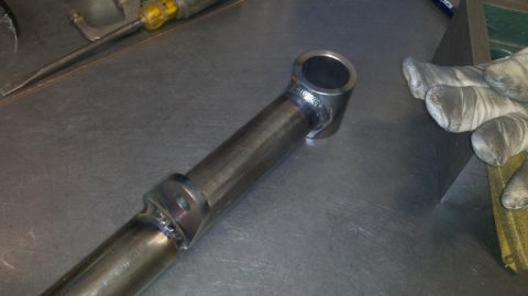 1971 Ford Bronco - A close-up view of a custom-fabricated metal tube part, showing detailed welding work.