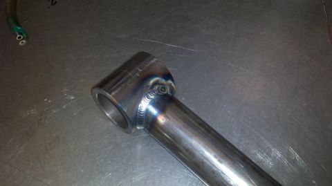 1971 Ford Bronco - Close-up of a custom welded metal tube assembly on a workbench.