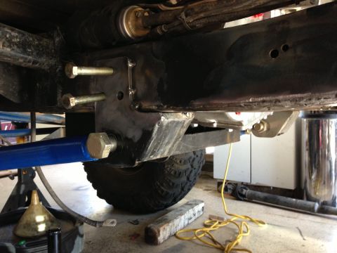 1971 Ford Bronco - Undercarriage view shows custom suspension work and part of a tire.