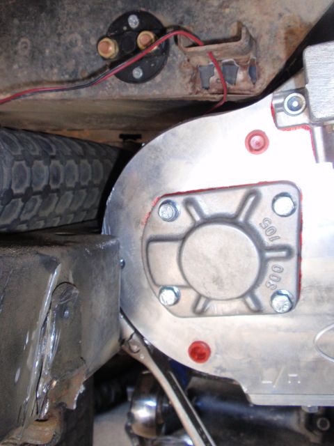 1971 Ford Bronco - A detailed view of a vehicle's chassis component, showing metalwork and wiring near a spare tire.
