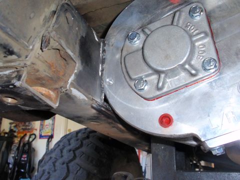 1971 Ford Bronco - Custom transfer case modification showing new welds on the frame and the attached component.