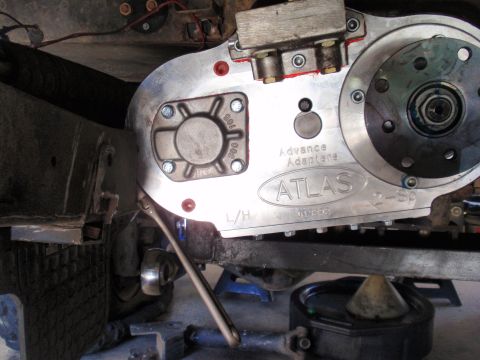 1971 Ford Bronco - Close-up of an Atlas transfer case being installed, showing the Advance Adapters branding and part numbers.