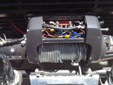 1971 Ford Bronco - Winch motor wiring and cable spool detail. Wiring connections are visible.