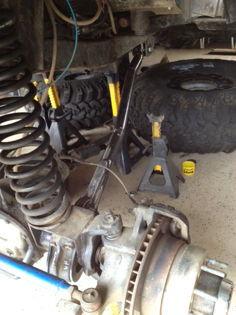 1971 Ford Bronco - Vehicle suspension components, including coil springs and jack stands, are visible in this close-up view.