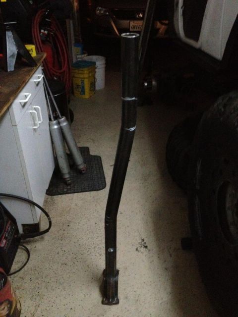 1971 Ford Bronco - A custom fabricated metal part is shown in a garage setting.