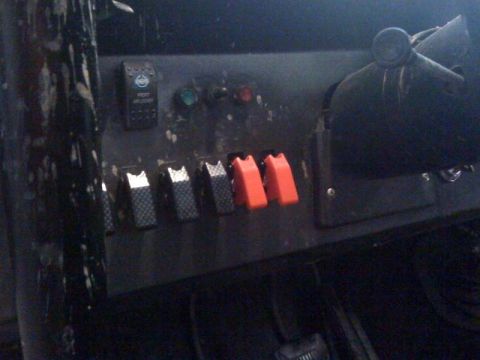 1971 Ford Bronco - Interior view of a vehicle's dashboard, showing various toggle switches.