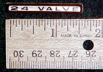 2003 Ford Expedition - A "24 VALVE" badge is shown next to a ruler, indicating its size and origin.
