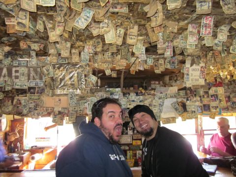 1971 Ford Bronco - Bar interior decorated with money on the ceiling, two men in the foreground.