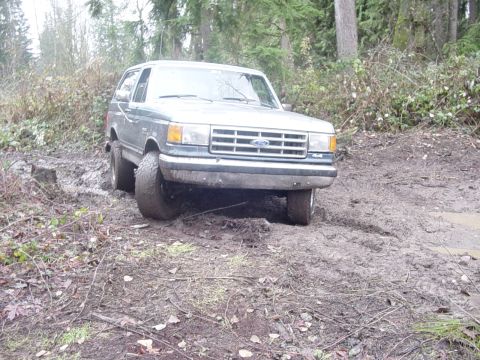 1987 Ford Bronco - This 1987 Ford Bronco is seen navigating a muddy off-road trail.
