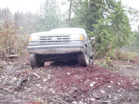 1987 Ford Bronco - This 1987 Ford Bronco is seen from the front, navigating an off-road terrain.