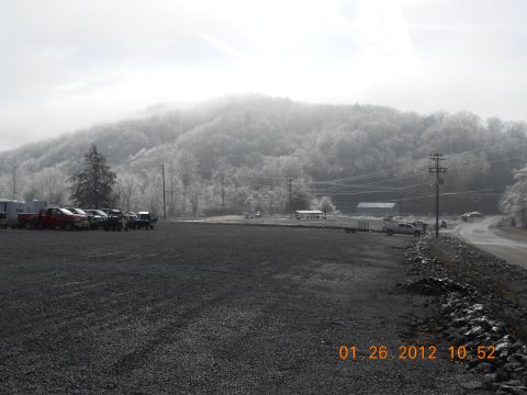 1986 Ford Bronco - A collection of trucks and trailers are visible in a rural setting on a frosty day, with a date stamp of 01/26/2012.