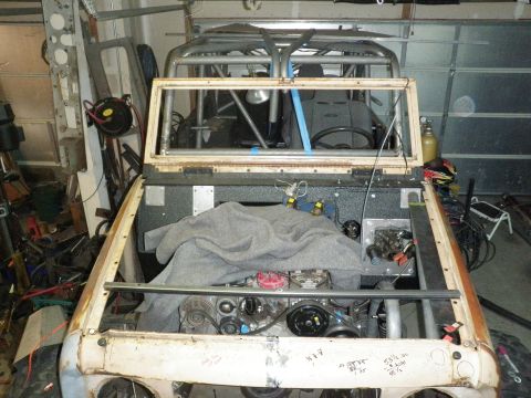 1961 International Scout 800 - This vehicle appears to be a custom build, possibly an International Scout, in a state of disrepair or modification.
