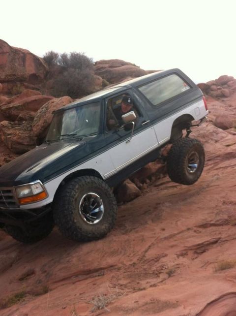 1994 Ford Bronco - This 1994 Ford Bronco navigates a challenging rocky trail, its off-road capabilities.